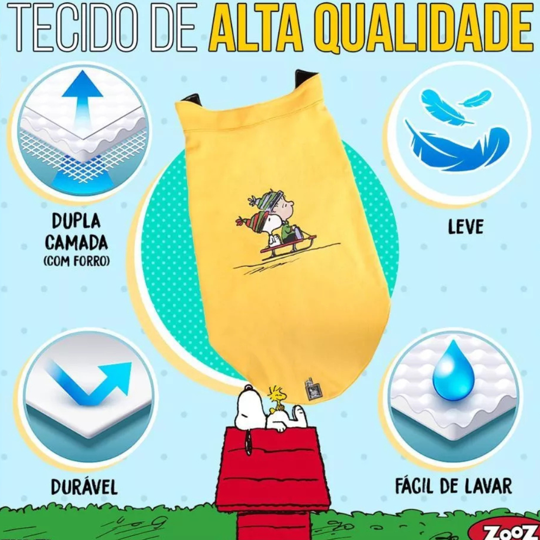 Informação sobre o tecido de um colete Zooz para cão na cor amarela, com detalhes em preto, com estampa do personagem a deslizar na neve com um gorro e cachecol, acompanhado do Woodstock. Vista frontal, sobre fundo branco.