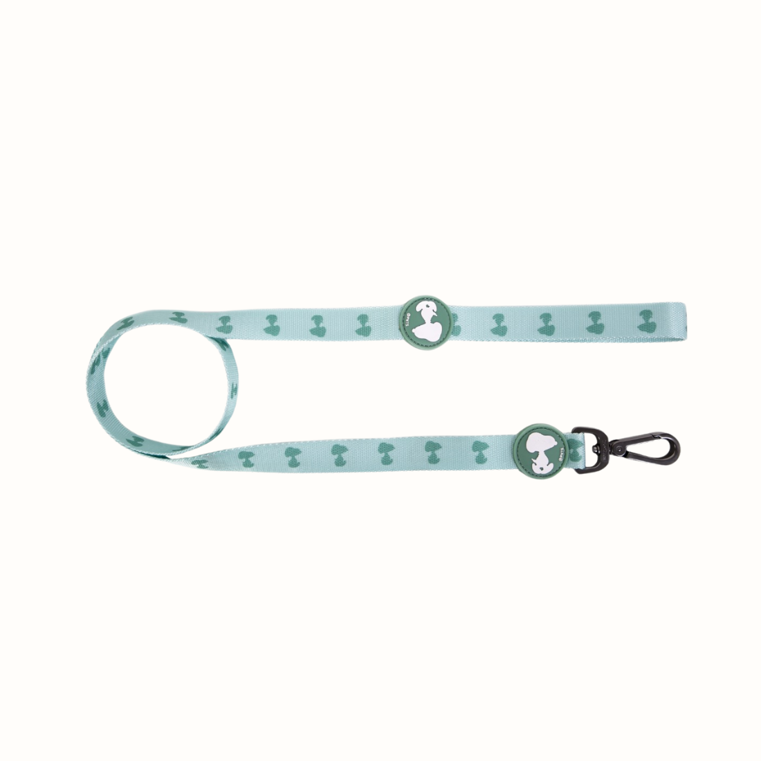 Trela Zooz, em padrão azul claro e verde claro e figuras do snoopy. Vista de frente, sobre fundo branco.