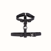 Arnês Snoopy Zooz, de cor preta do snoopy. Vista de frente, sobre fundo branco.