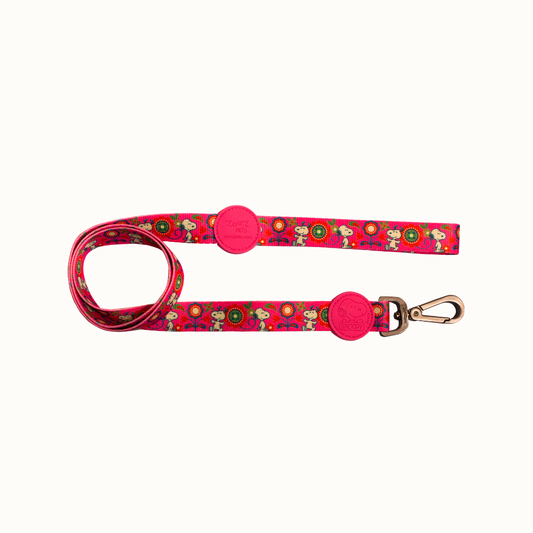 Trela Zooz ajustável, de padrão cor de rosa e floral, com figuras do snoopy. 
Vista de frente, sobre fundo branco. 