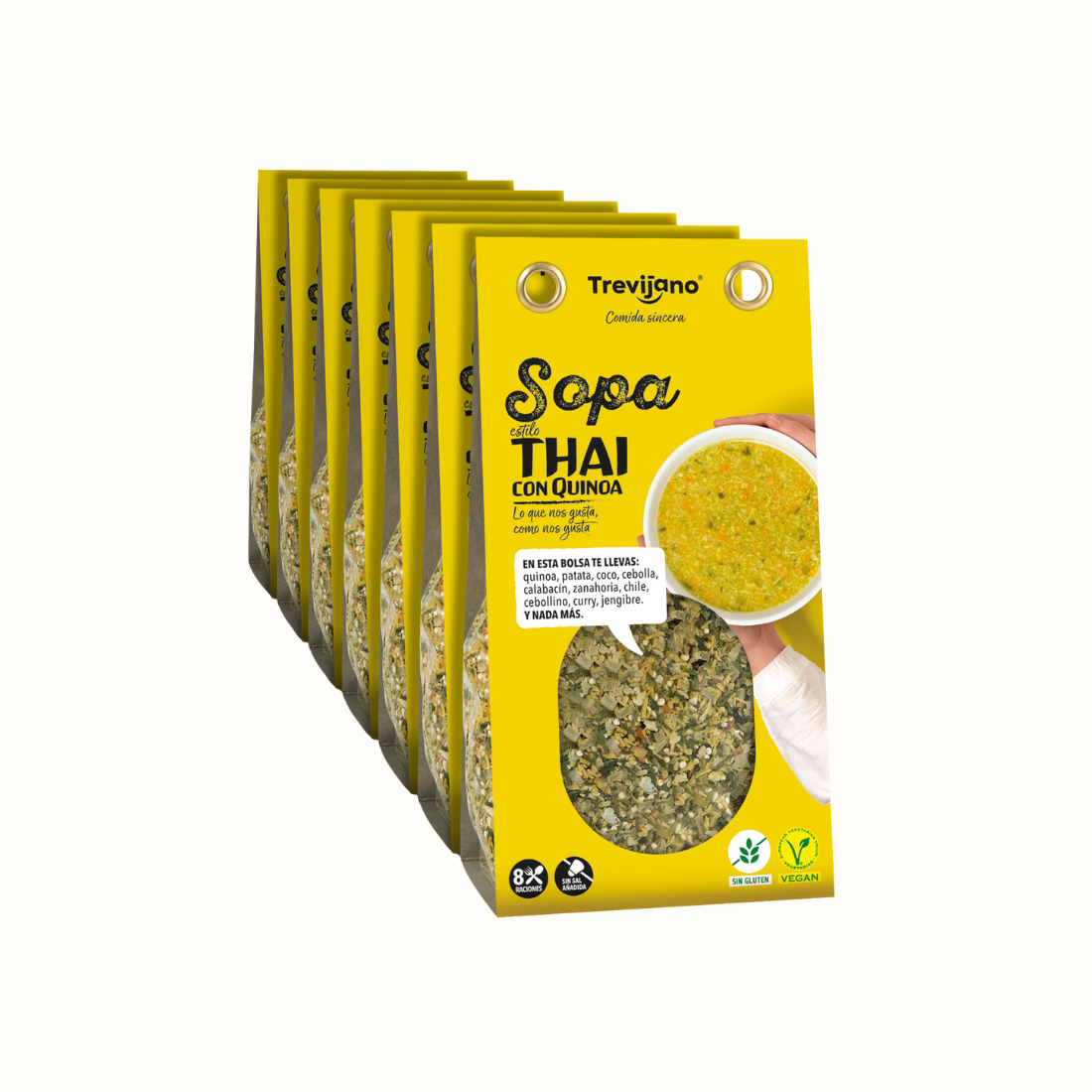 Sopa Thai de Quinoa em embalagem de cartão e plástico transparente, com uma mistura de quinoa, vegetais desidratados e especiarias tailandesas. A embalagem tem um rótulo com o nome do produto e informações nutricionais. Fundo branco